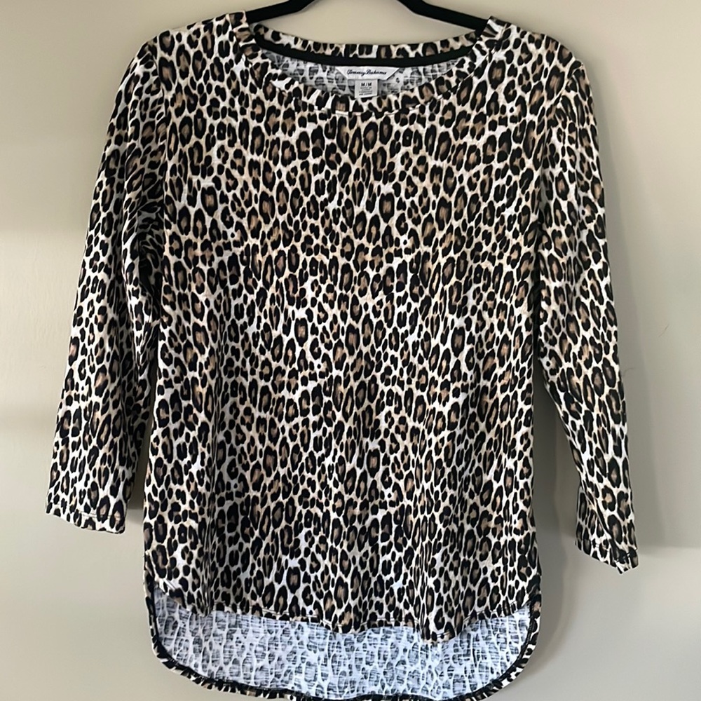 Three-quarter sleeve Tommy Bahama casual top with animal print and Hi/low hem.